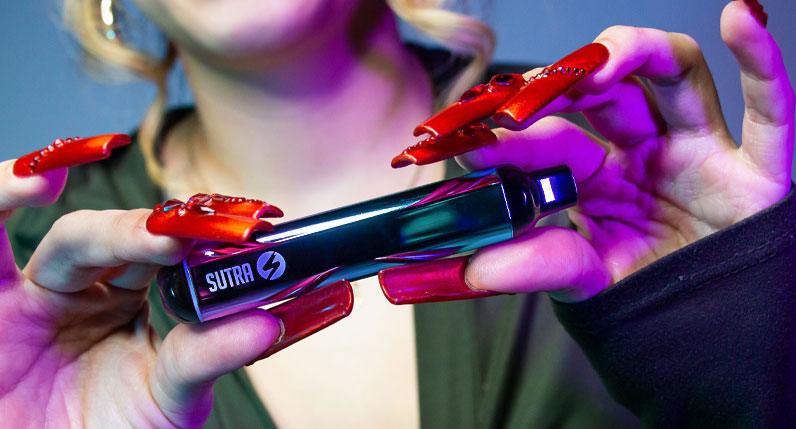 Lady holding 510 cartridge vape - shell shock